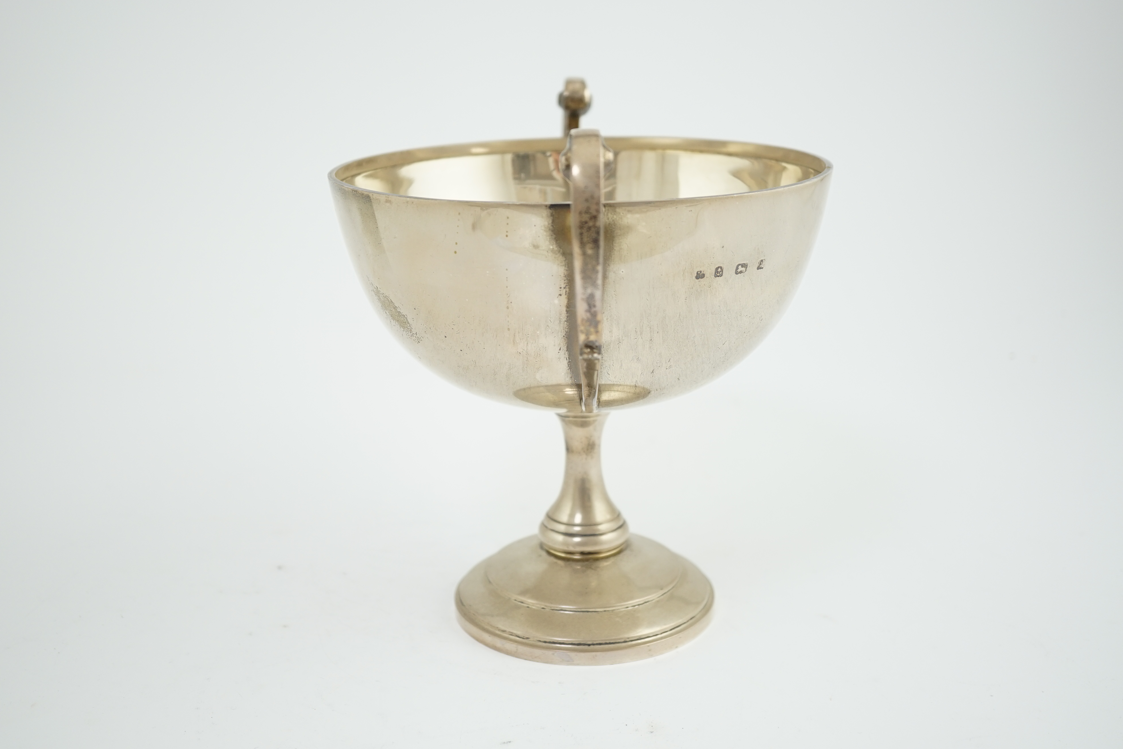 A George V silver two handled pedestal trophy cup, by Martin, Hall & Co Ltd